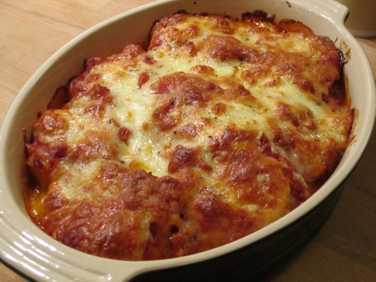 Baked Polenta Baked polenta with tomato sauce and mozzarella