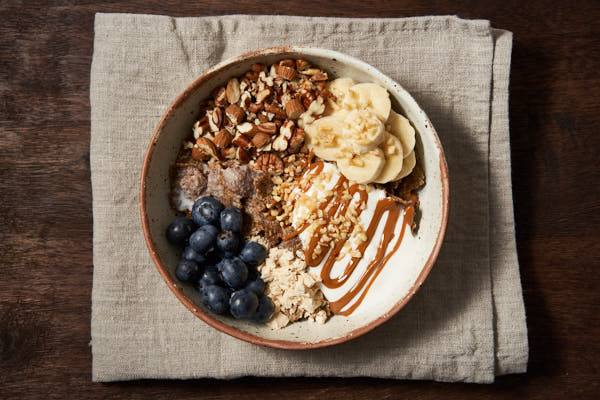Brank Flakes with yoghurt, nuts, fruit and protein powder