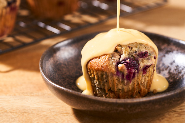 Bird's custard (made from powder) poured over a blueberry and raspberry muffin