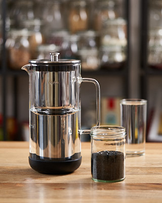 Small Aarke water purifier and a jar of activated carbon