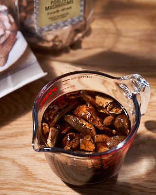 Dried porcini mushrooms soaking in hot water
